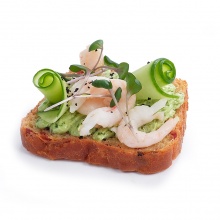 Beet bread slice with spinach cream cheese, shrimps and fresh cucumber